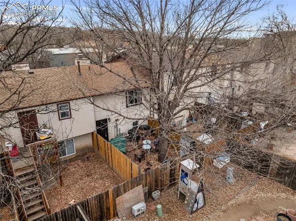 a aerial view of a house with a yard