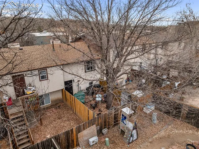 a aerial view of a house with a yard