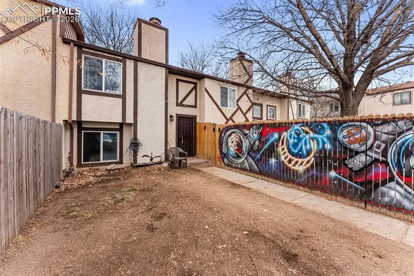 a view of a house with a snow in the yard