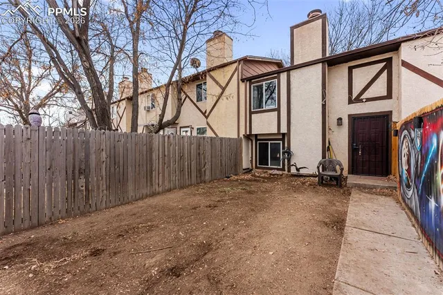 a kitchen with granite countertop a sink and a stove top oven