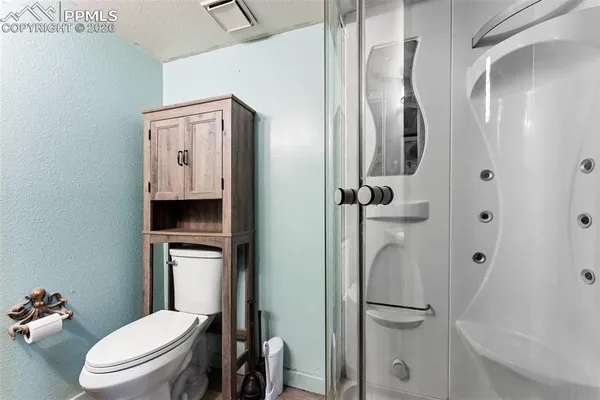 a work room with furniture and wooden floor