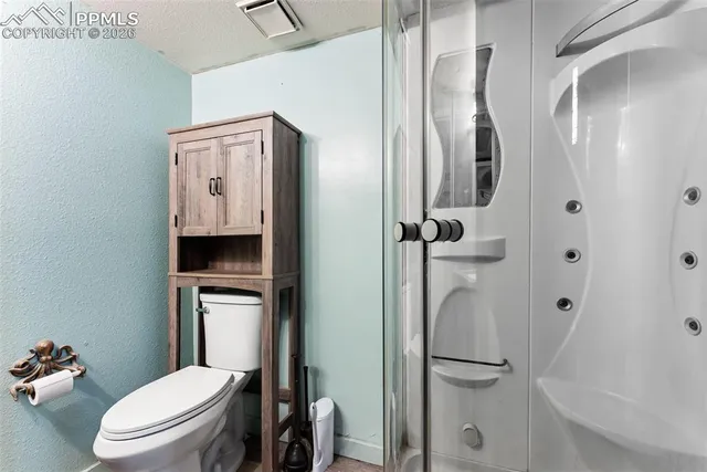 a work room with furniture and wooden floor