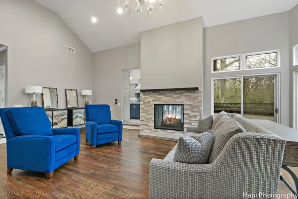 a living room with furniture and a fireplace