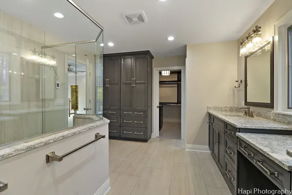 a bathroom with a shower and a sink