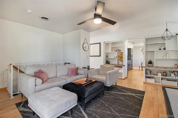 a living room with furniture and a rug