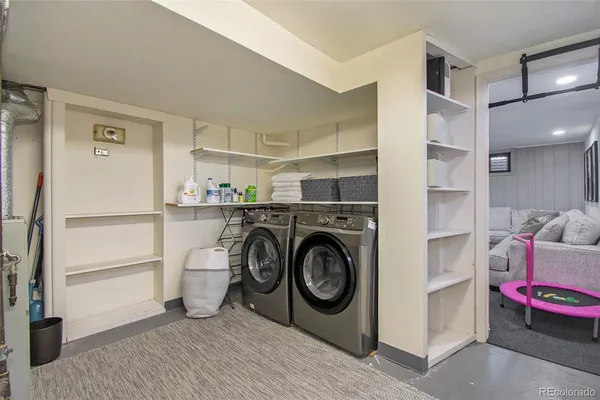 a utility room with closet dryer and washer