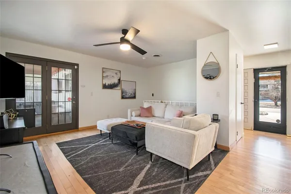 a living room with furniture and a rug