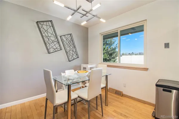 a view of a dining room with furniture window and wooden floor