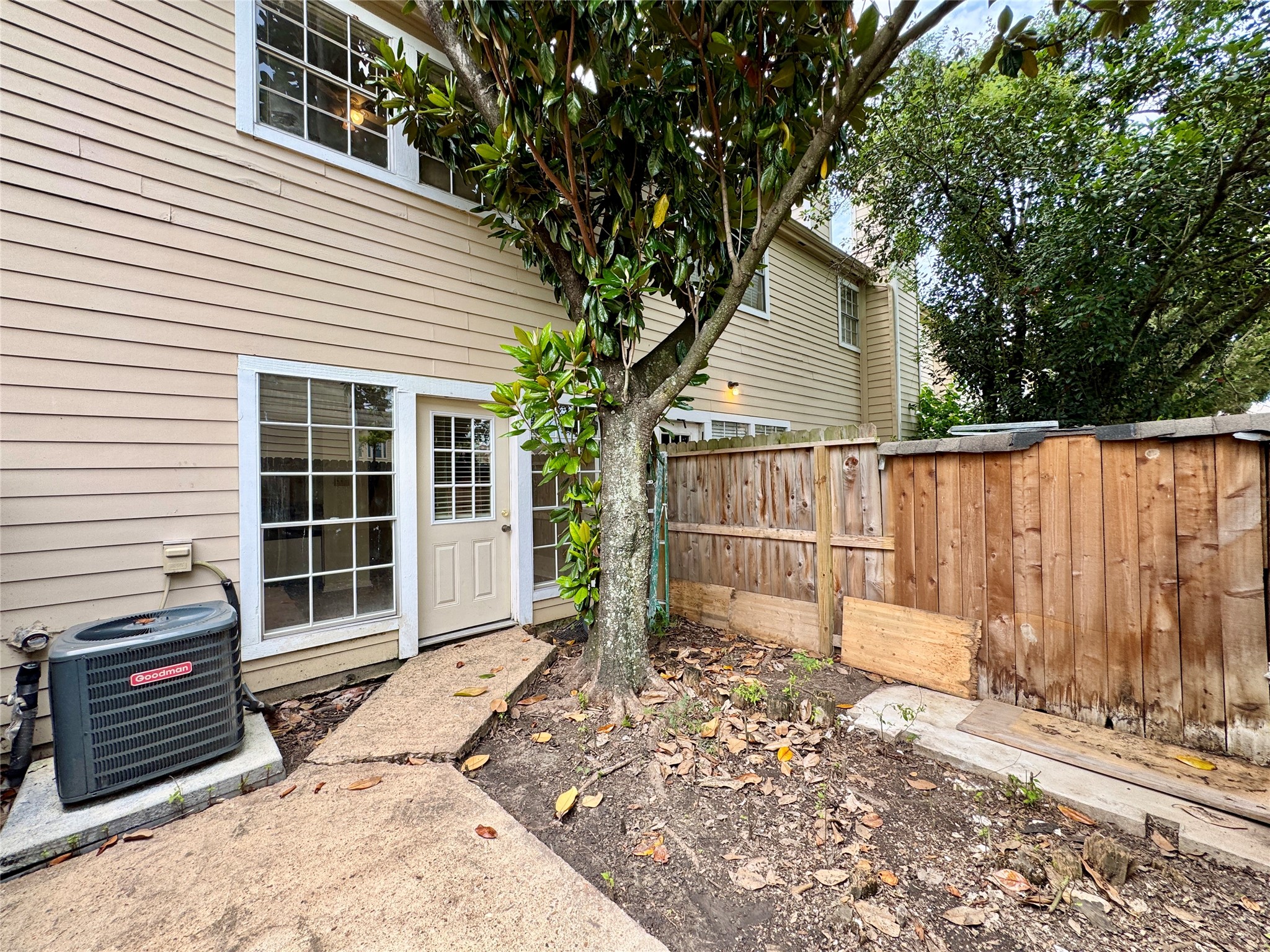 2002 Gentryside Drive, Unit 103 Houston, TX 77077 - Photo 18 of 20 Fully fenced and extended slab for you to place your favorite outdoor furnishings, the gate leads to the sidewalk that will lead you to the community swimming pool.