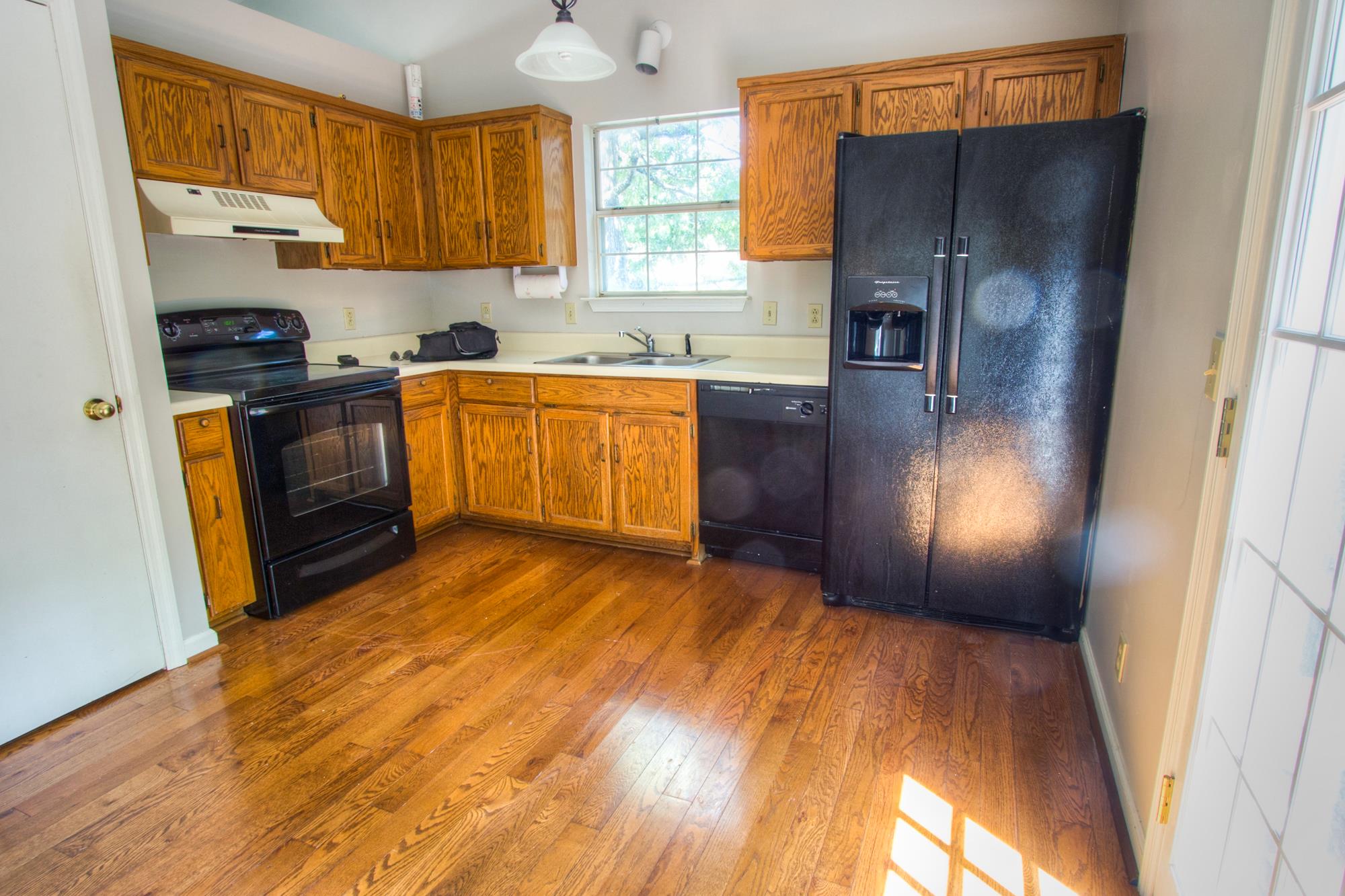884 Bishopsgate Road Antioch, TN 37013 - Photo 3 of 12 a kitchen with granite countertop stainless steel appliances a refrigerator a sink a stove a microwave and cabinets