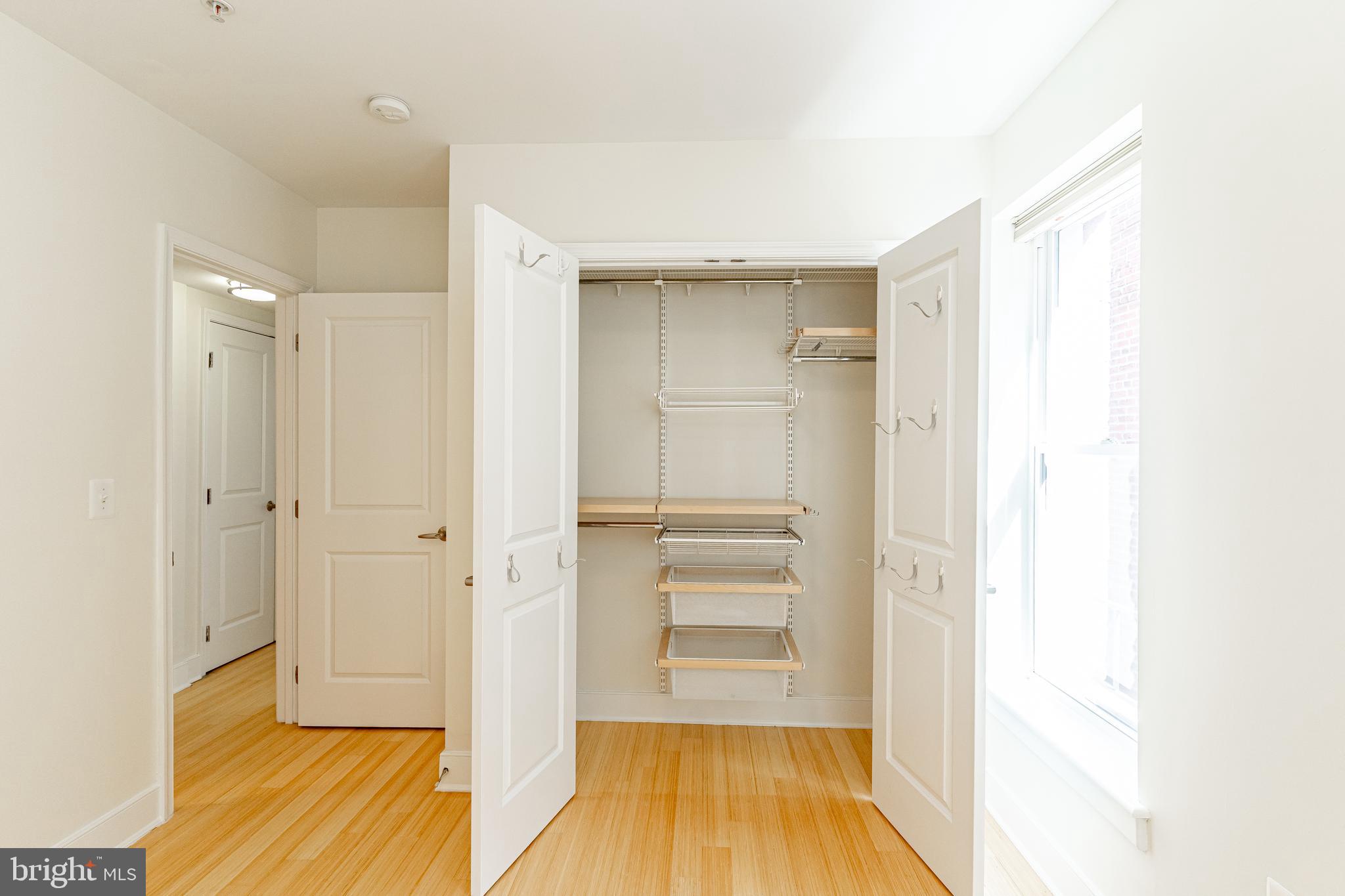 1108 Columbia Road Northwest, Unit 301 Washington, DC 20009 - Photo 14 of 20 Primary bedroom w/Elfa closet system