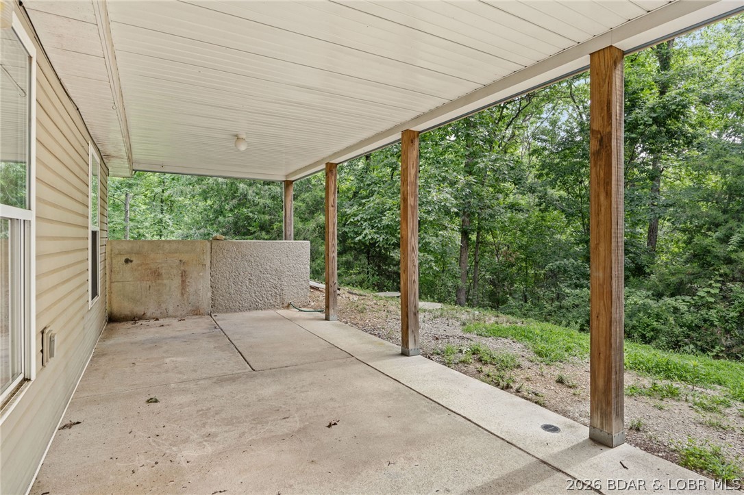 122 Hicks Drive Eldon, MO 65026 - Photo 37 of 51 Covered porch off walk out basement