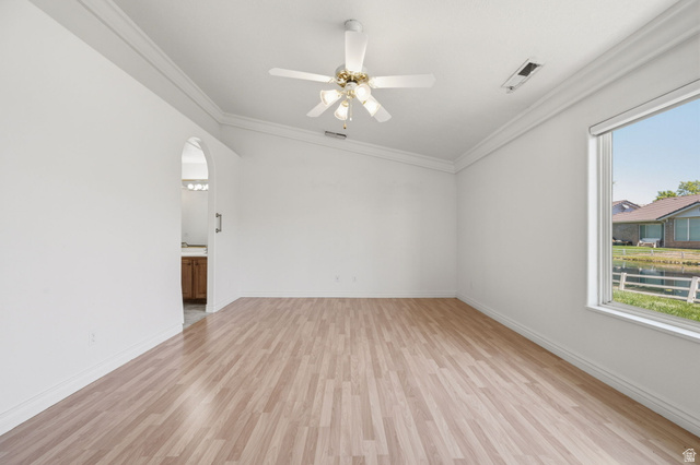 805 South River Road, Unit 70 St. George, UT 84790 - Photo 17 of 38 Room featuring wood-finish flooring, white walls, and crown molding