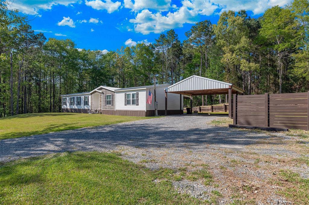 339 Cycle Plant Road Benton, LA 71006 - Photo 2 of 25 a view of house with backyard and swimming pool