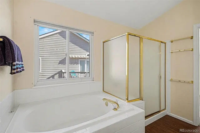 a bathroom with a bathtub and a shower