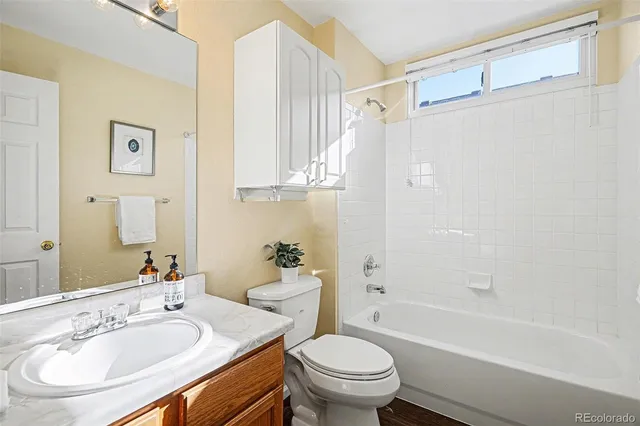 a bathroom with a sink a toilet and a bathtub