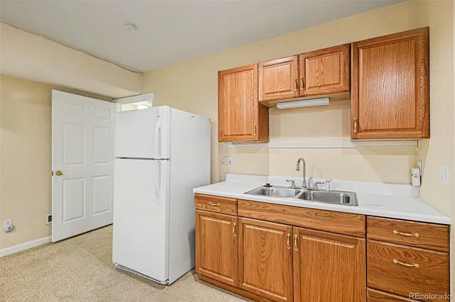a kitchen with stainless steel appliances granite countertop a refrigerator sink and cabinets