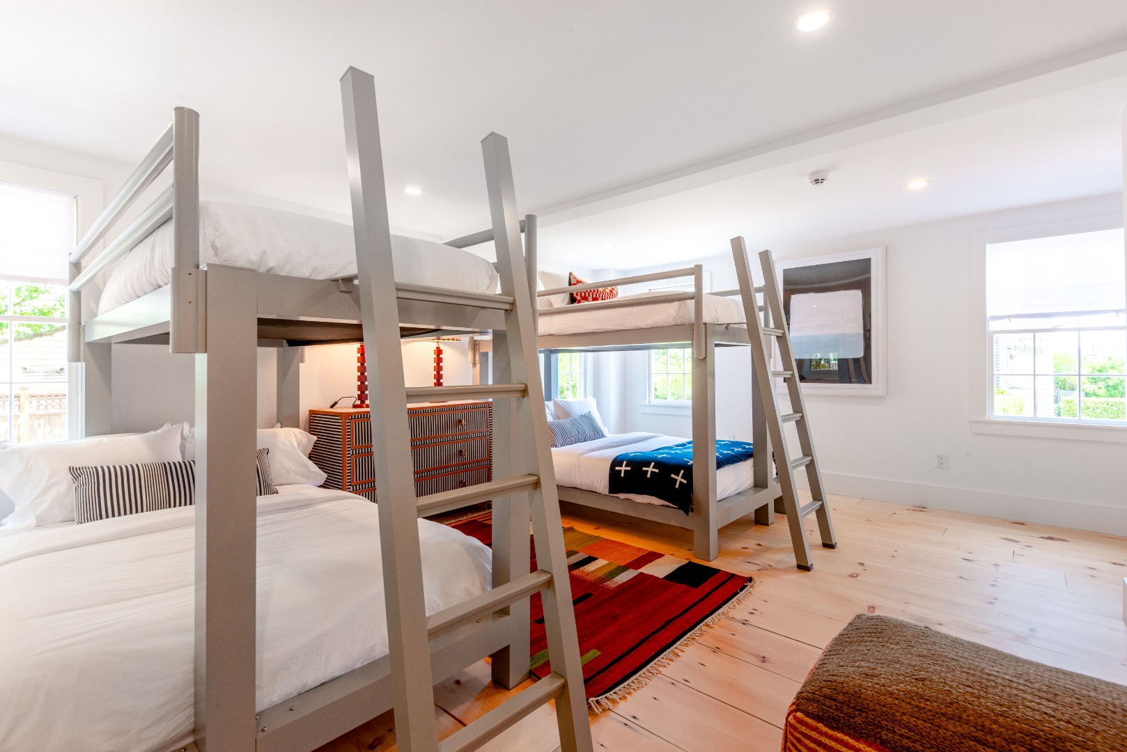 12 Willard Street Nantucket, MA 02554 - Photo 23 of 36 a bedroom with furniture and a wooden floor