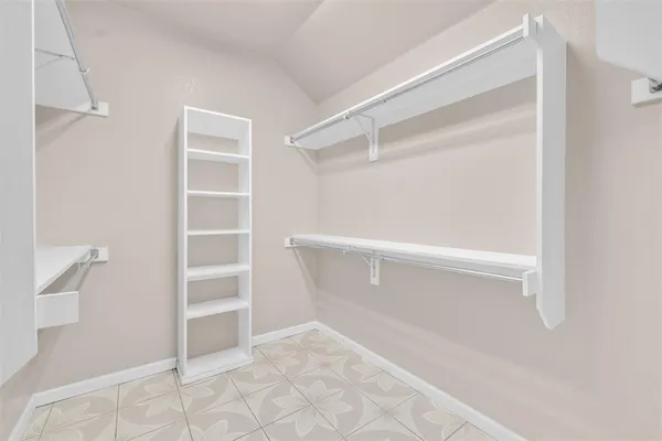 a view of an empty walk in closet