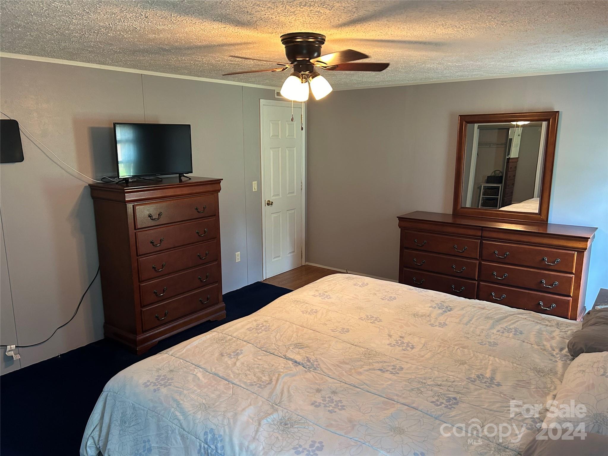 3250 Ferguson Long Road York, SC 29745 - Photo 21 of 32 a bedroom with a bed and a flat screen tv