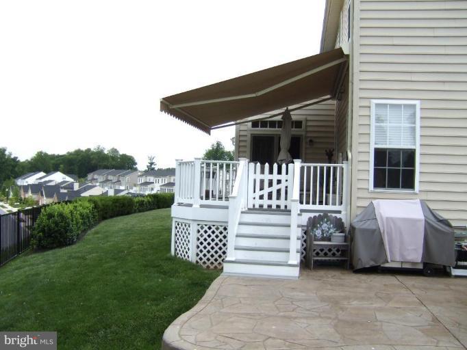 4401 Summer Grape Road, Unit 4401 Pikesville, MD 21208 - Photo 27 of 28 covered deck and adjoining patio
