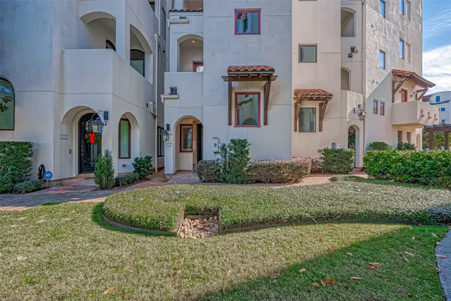 a living room with furniture a ceiling fan and a rug