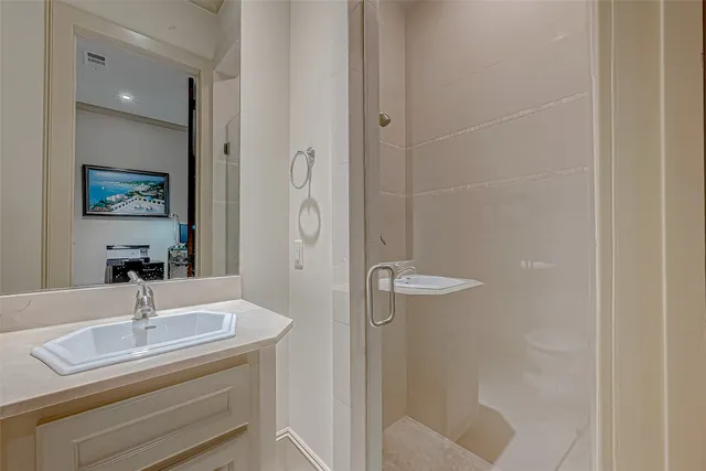 a bathroom with a shower and toilet