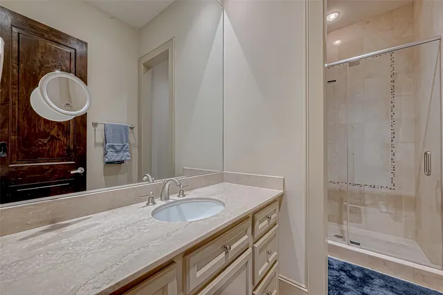 a view white cabinets and wooden floor