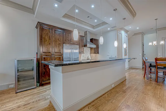 a kitchen with stainless steel appliances granite countertop a sink and stove