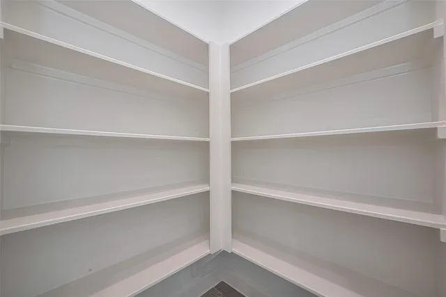 a view of an empty walk in closet