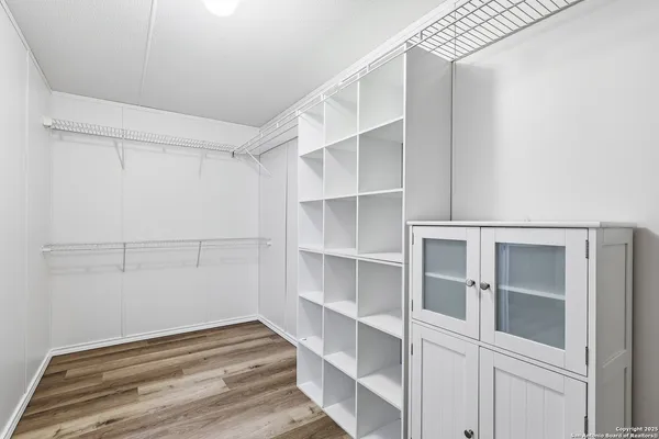 a view of an empty walk in closet