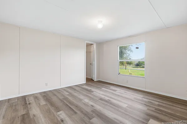 an empty room with window