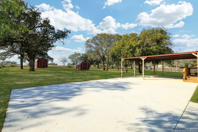 a view of a house with a big yard