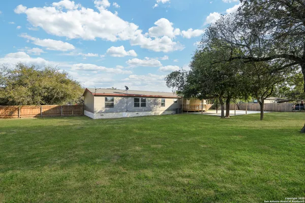 a view of a house with a big yard