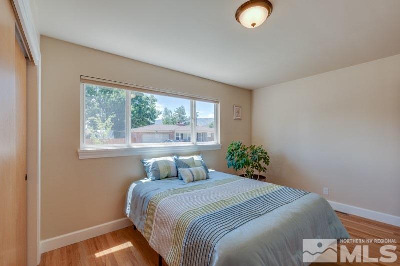 1435 Romero Way Reno, NV 89509 - Photo 8 of 28 a bedroom with a bed and window
