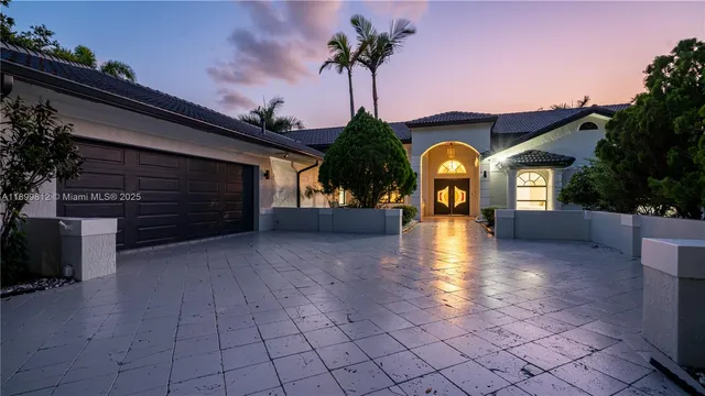 a view of a house with brick walls and a potted plant