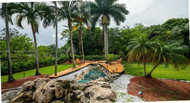 a bedroom with a bed and lamps