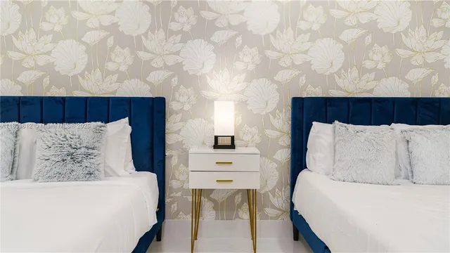 a bedroom with double bed and a window