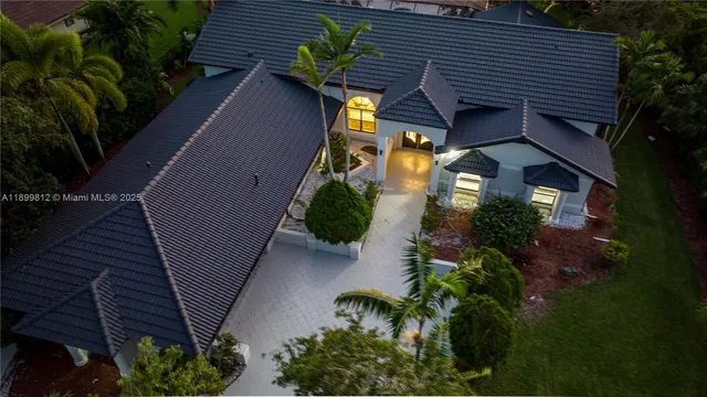 a view of a house with a flower garden