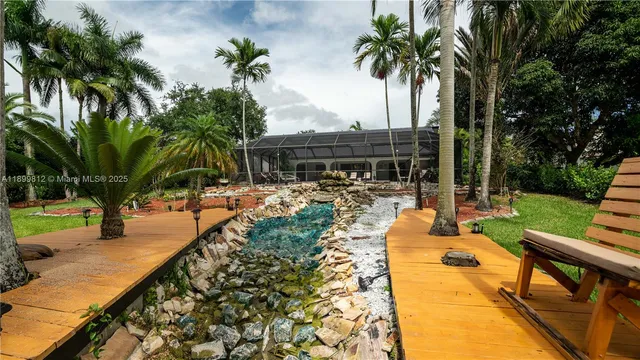 a view of a swimming pool with sitting area