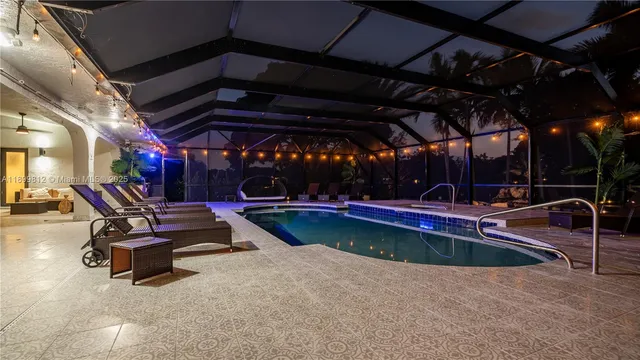 a view of a swimming pool with a patio