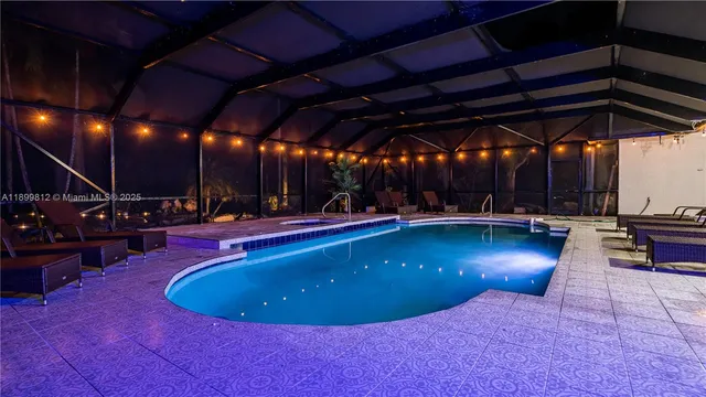 a view of a swimming pool with an outdoor space