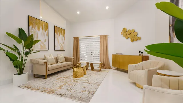 a living room with furniture and a potted plant