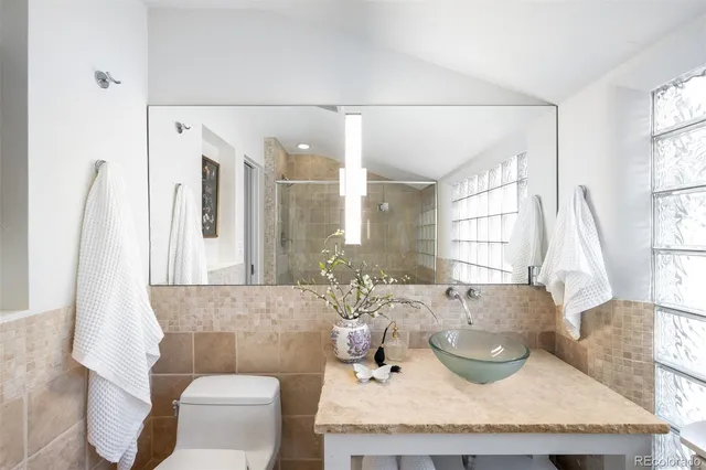 a view of a room with wooden floor and windows