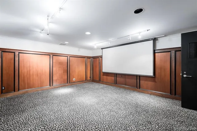 a view of a house with a porch and a tree
