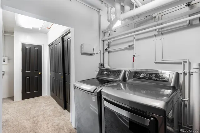 a front view of a house with garden and sitting area