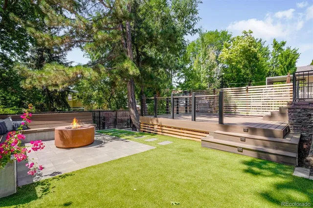 a view of a backyard with sitting area
