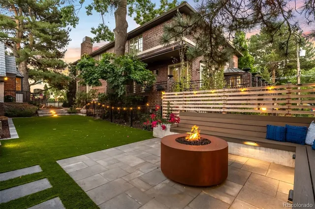a view of a backyard with swimming pool