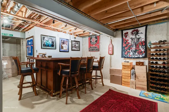 a view of a dining room with furniture and a chandelier