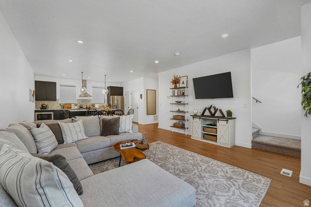 493 East Alice Way Layton, UT 84041 - Photo 11 of 31 Living room featuring wood finished floors and recessed lighting